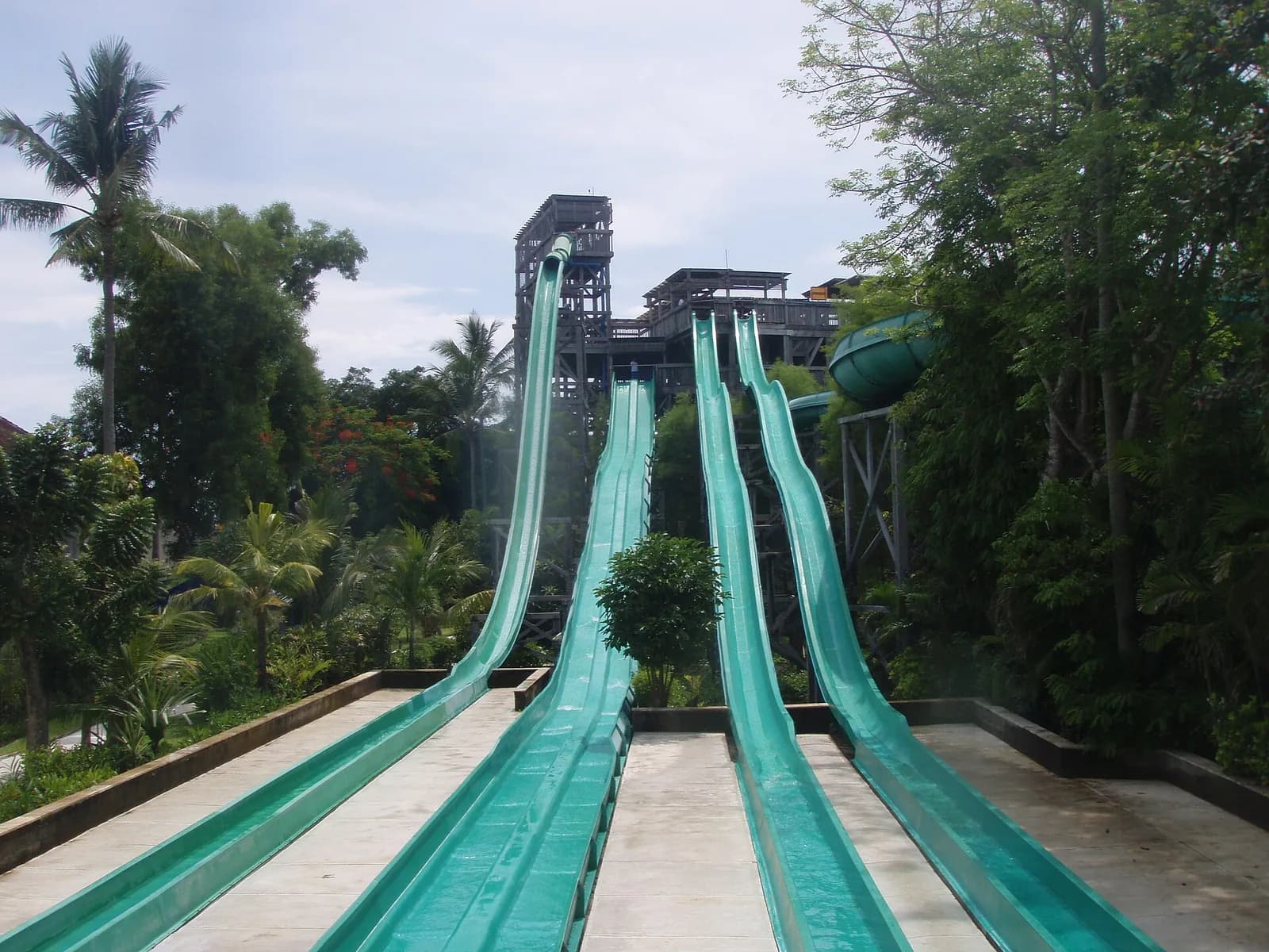 Smashdown and the neighbouring slides rising to the wooden tower at Waterbom Bali, Kuta