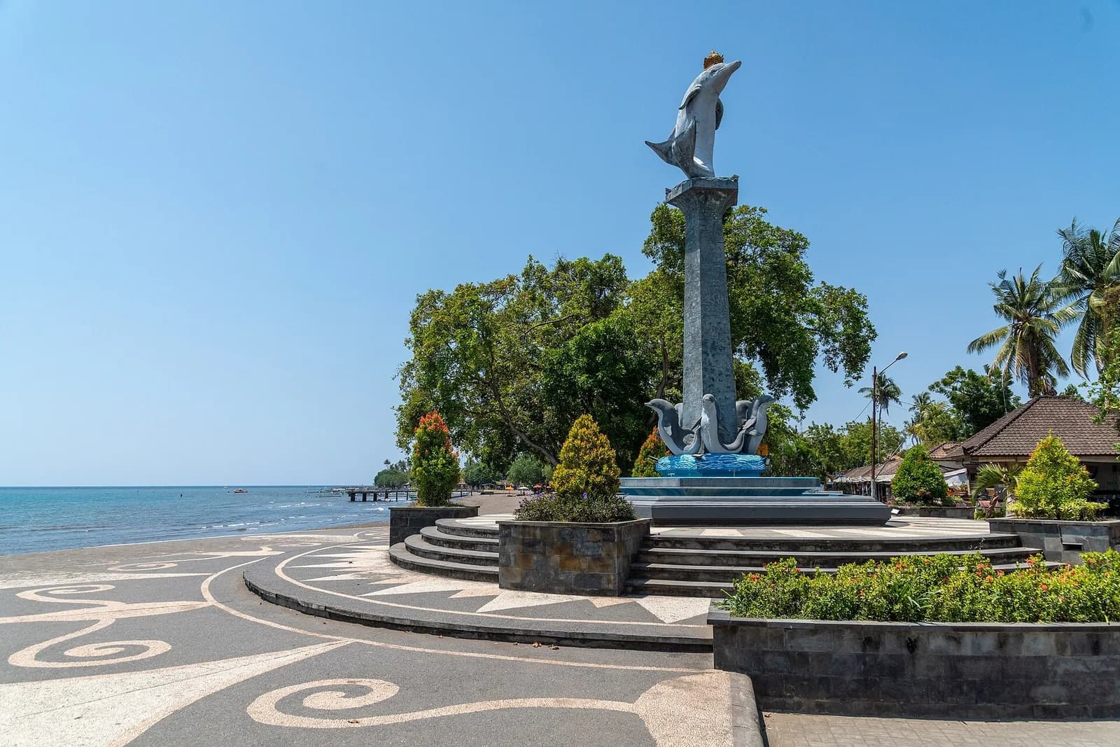 Dolphin statue on the seafront at Kalibukbuk beach, Lovina, north Bali