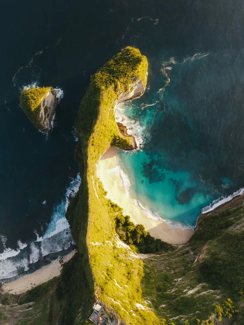 Aerial view of the Kelingking headland with the trail visible descending the ridge to the beach, Nusa Penida