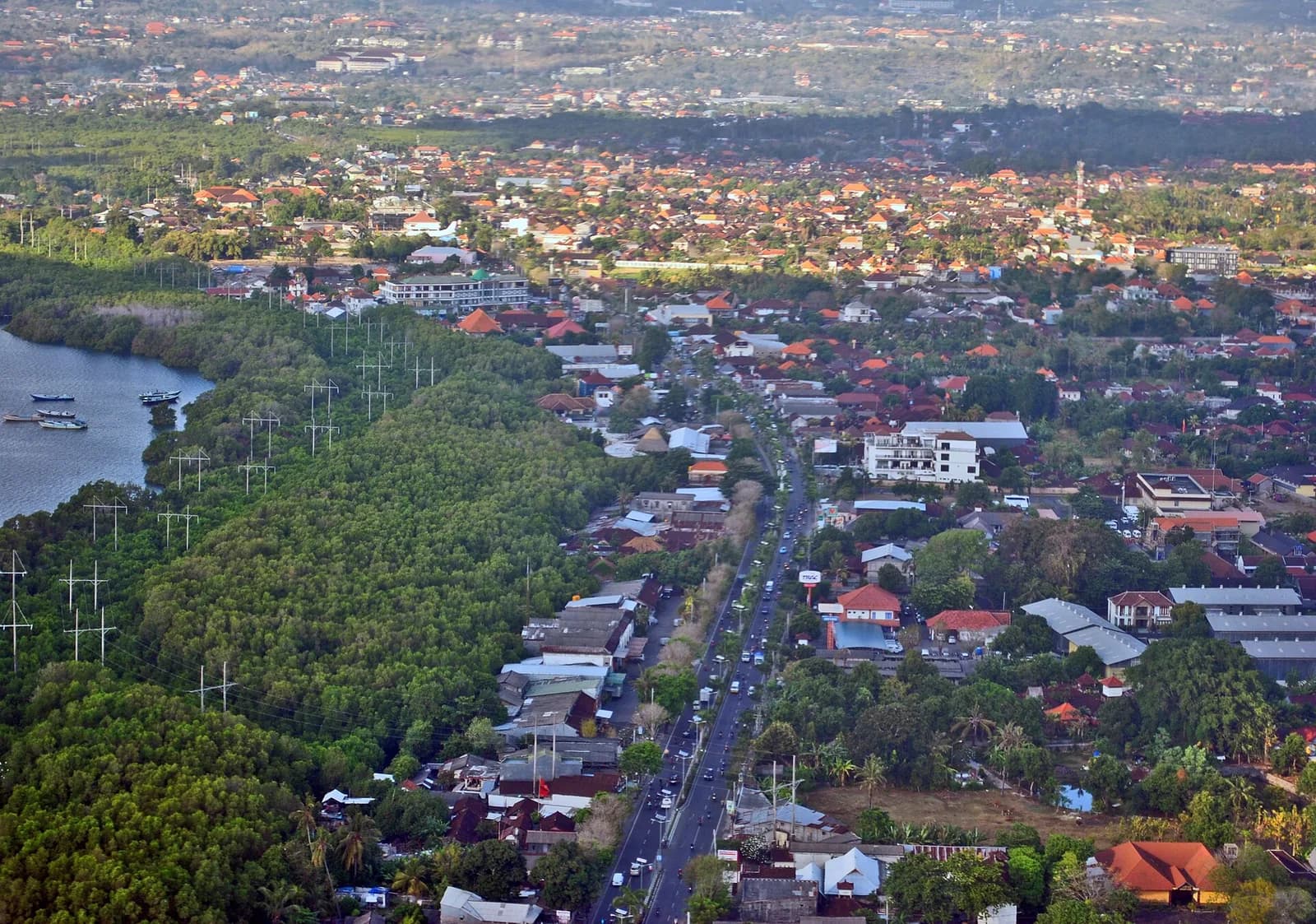 Aerial view of the Ngurah Rai bypass running north from Bali airport, with the Benoa bay mangroves on the left, the first stretch of the road to Ubud