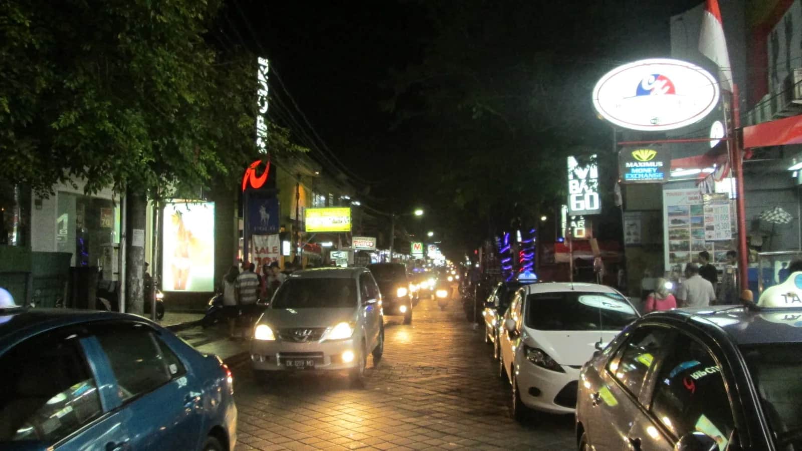 Evening traffic of taxis and cars on Jalan Legian, Bali, on the way from the airport to Seminyak