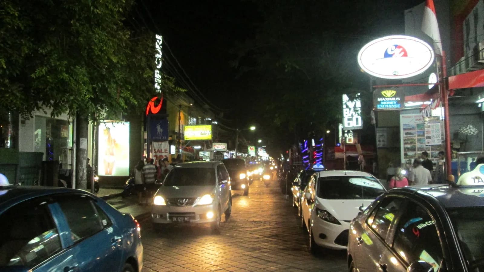 Taxis and cars on Jalan Legian at night, on the road from Bali airport to Seminyak