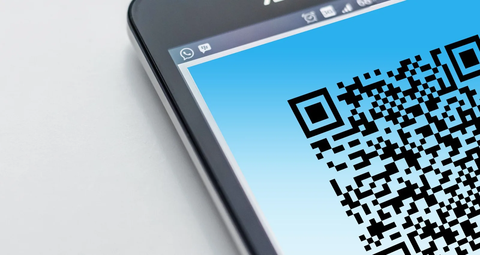 Close-up of a smartphone screen displaying a QR code