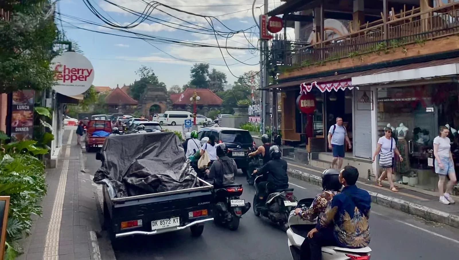 Traffic on Monkey Forest Road in central Ubud, where app taxis are restricted from picking up