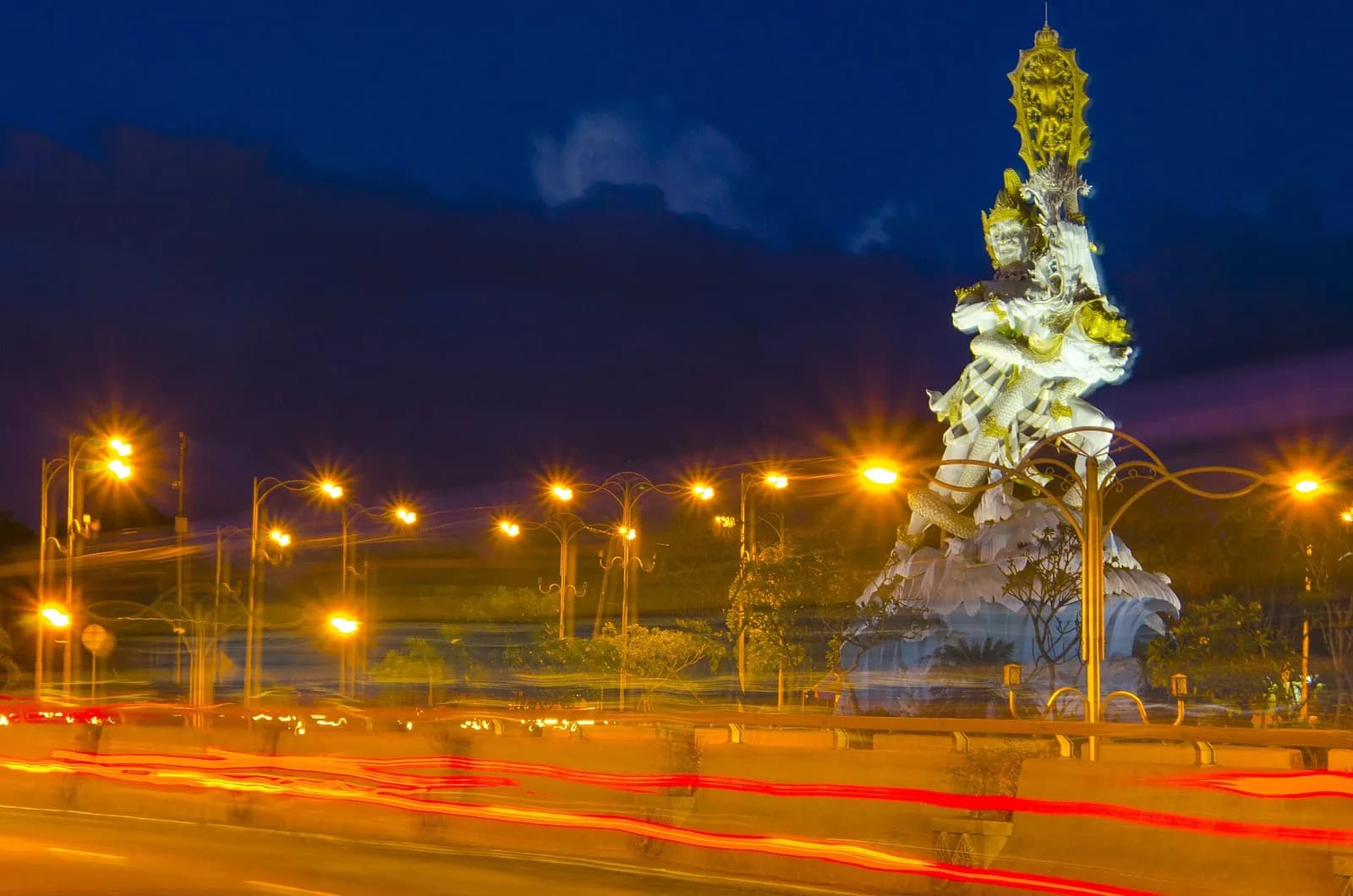 The Dewa Ruci statue lit at night on the Simpang Siur roundabout in Kuta, Bali, on the road from the airport to Seminyak