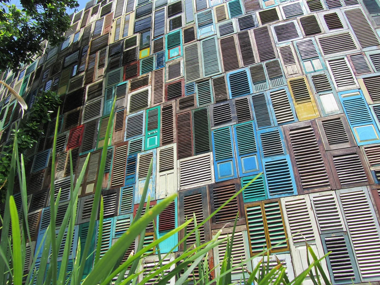 Wall of recycled wooden shutters in many colours at Potato Head, Seminyak, Bali