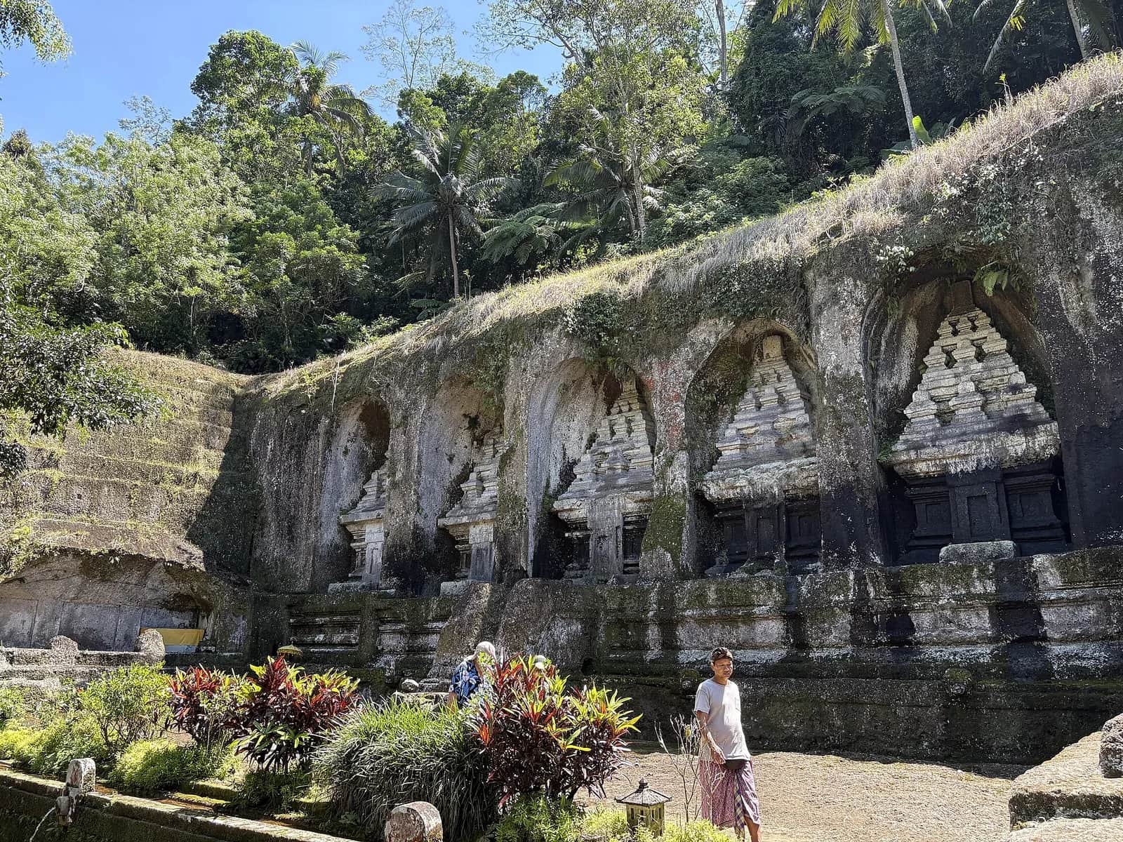 Rock-cut candi shrines carved into the cliff face at Gunung Kawi temple, Tampaksiring, Bali