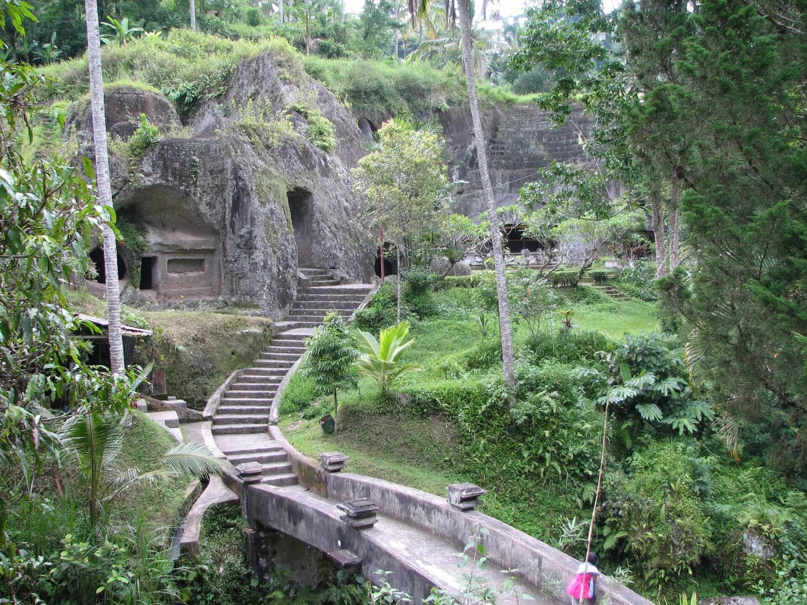 Stone staircase and arched bridge leading to the rock-cut caves at Gunung Kawi, Tampaksiring, Bali