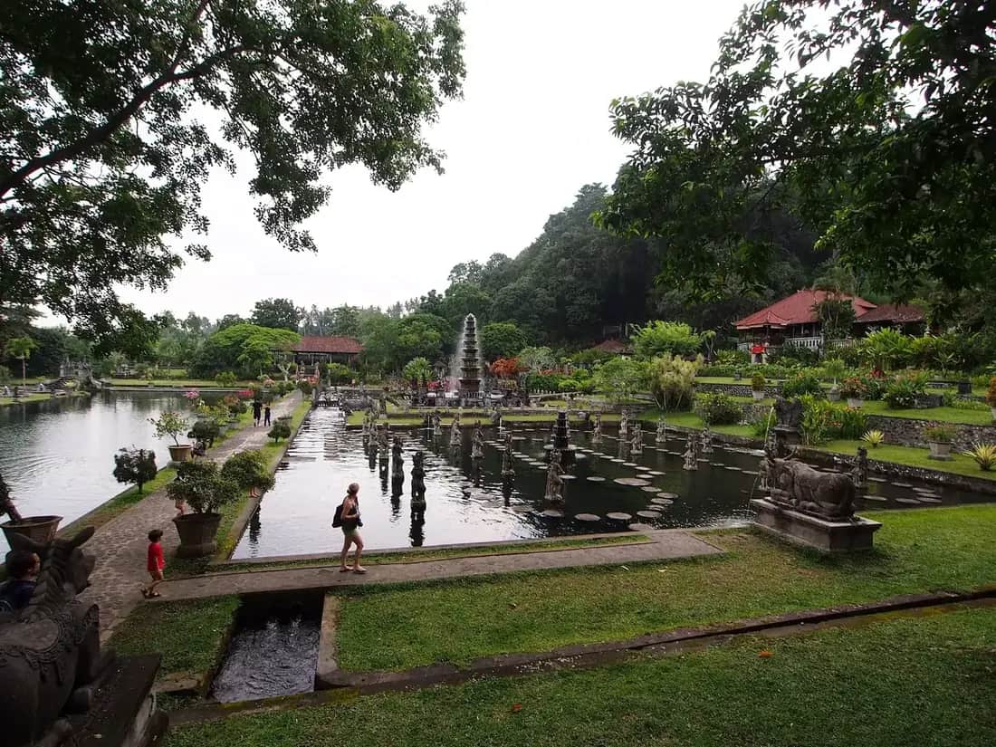 Stepping stones across the koi pond and the tiered fountain at Tirta Gangga, Karangasem, Bali