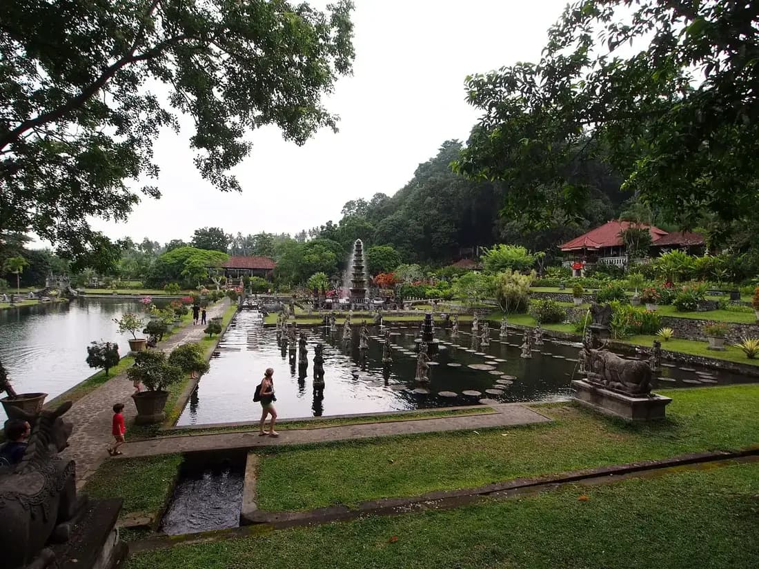 Stepping stones across the koi pond and the tiered fountain at Tirta Gangga, Karangasem, Bali