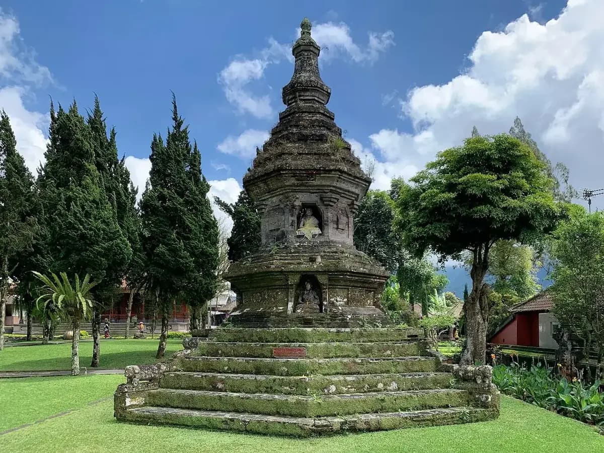 The stone Buddhist stupa on its stepped base in the gardens of Ulun Danu Beratan