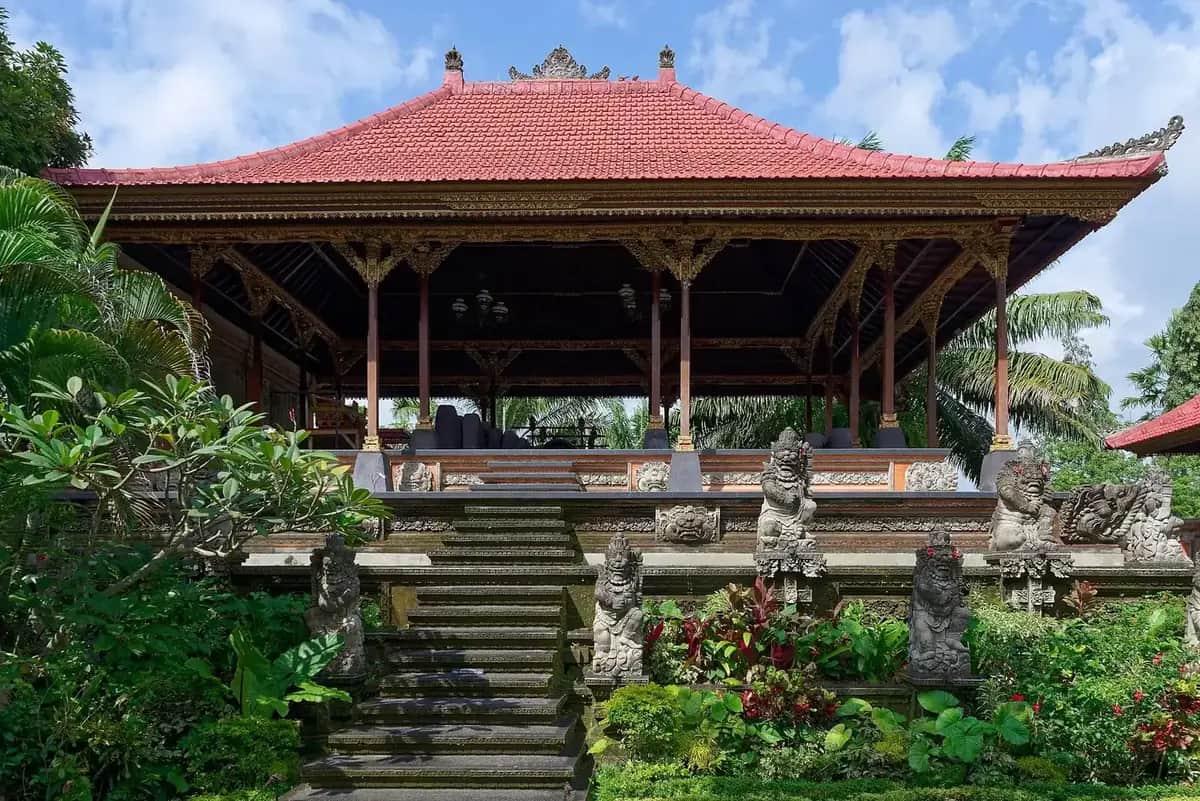 The open performance pavilion with its carved gilt beams at Ubud Palace, Bali