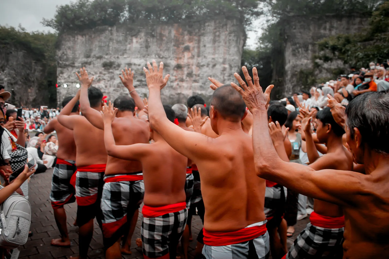 Kecak dance performance in front of the quarried limestone cliffs at GWK Cultural Park, Bali