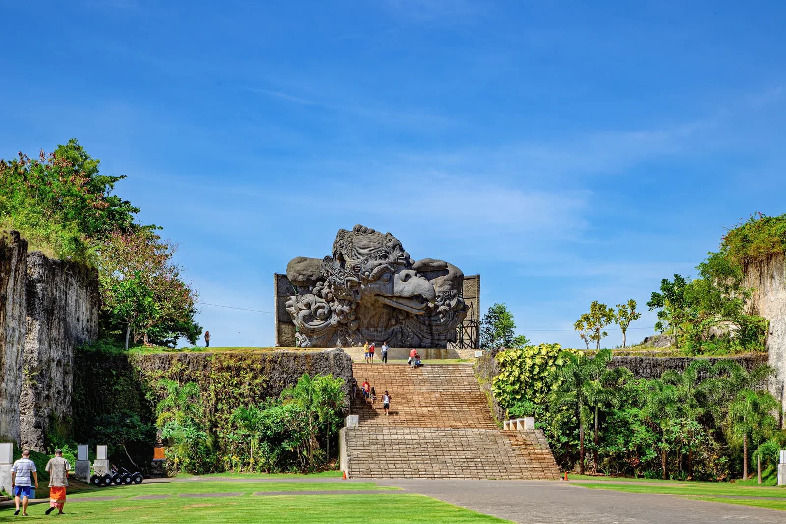 Carved limestone cliff walls at Plaza Garuda, Garuda Wisnu Kencana Cultural Park, Bali