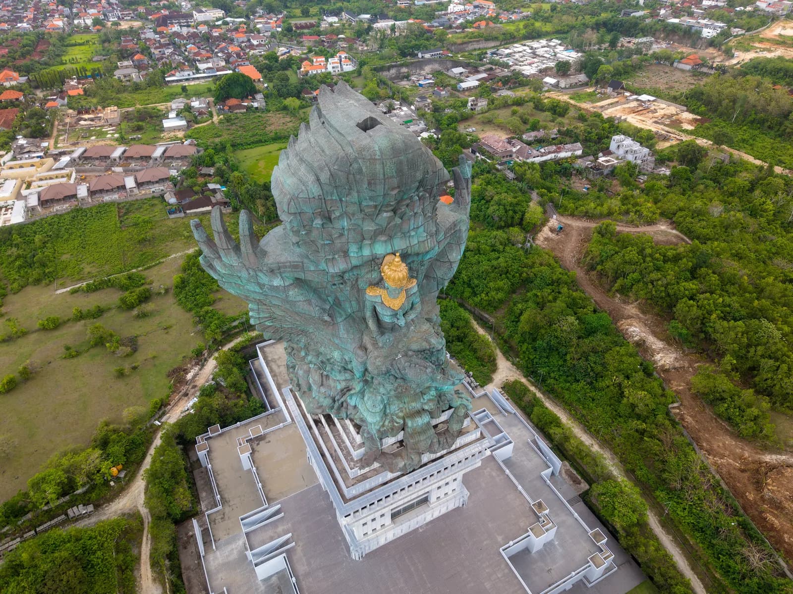 Aerial view of the full Garuda Wisnu Kencana statue and its pedestal building, Bali