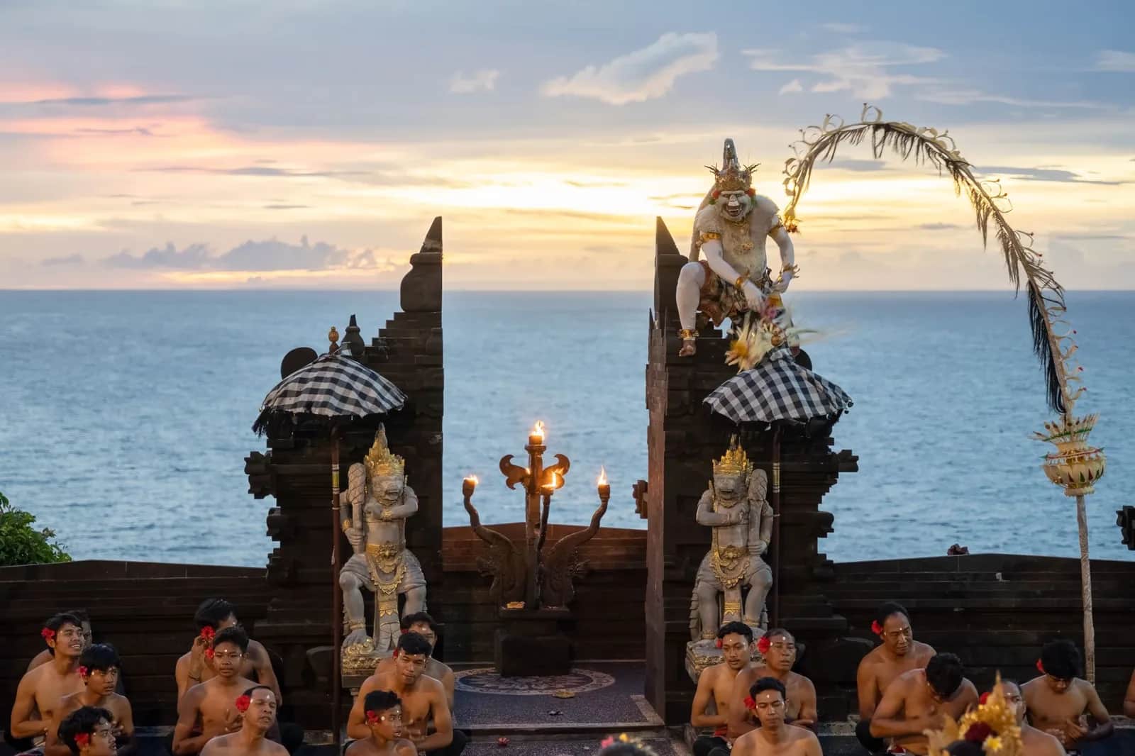 The kecak chanting circle performing at sunset in the clifftop amphitheatre at Uluwatu, Bali