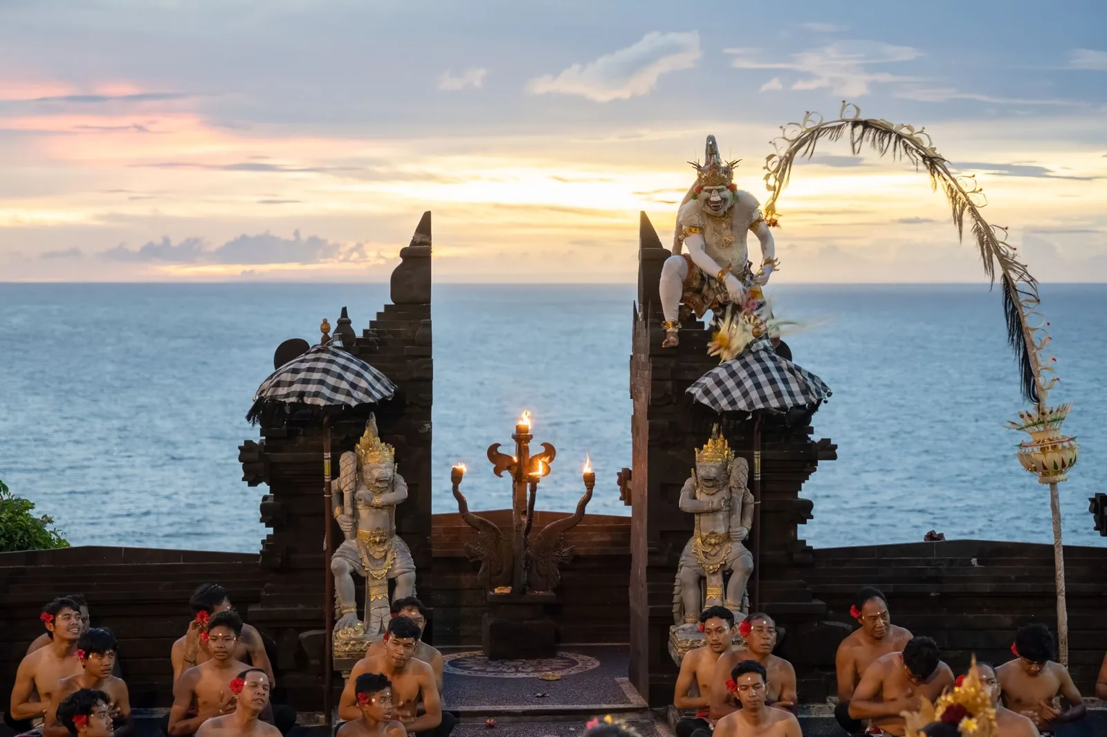 The kecak chanting circle performing at sunset in the clifftop amphitheatre at Uluwatu, Bali