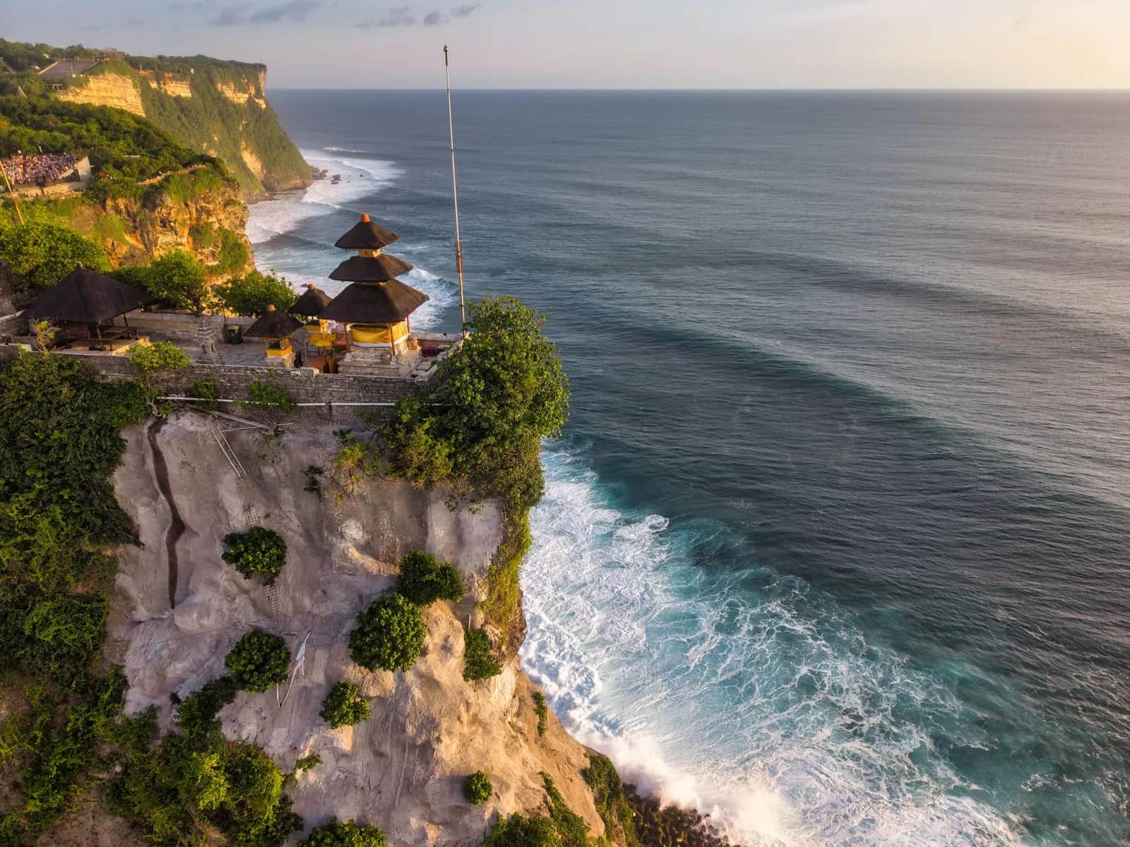 The shrine of Pura Luhur Uluwatu on the edge of its limestone cliff above the Indian Ocean, Bali
